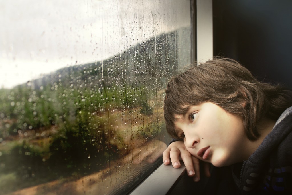 Child looking out of a window