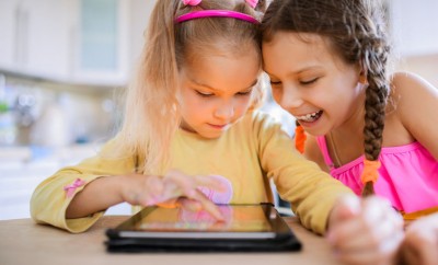 2 girls using digital technologies in the nursery