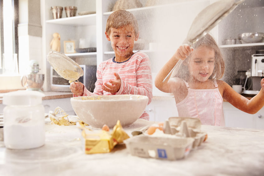 41393031 – two children having fun baking in the kitchen