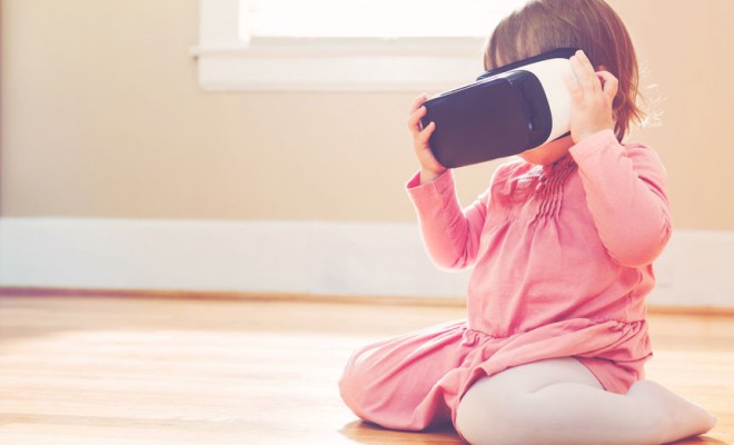 toddler girl using a new virtual reality headset