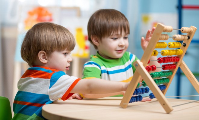 Numeracy Skills - Children counting on an abacus