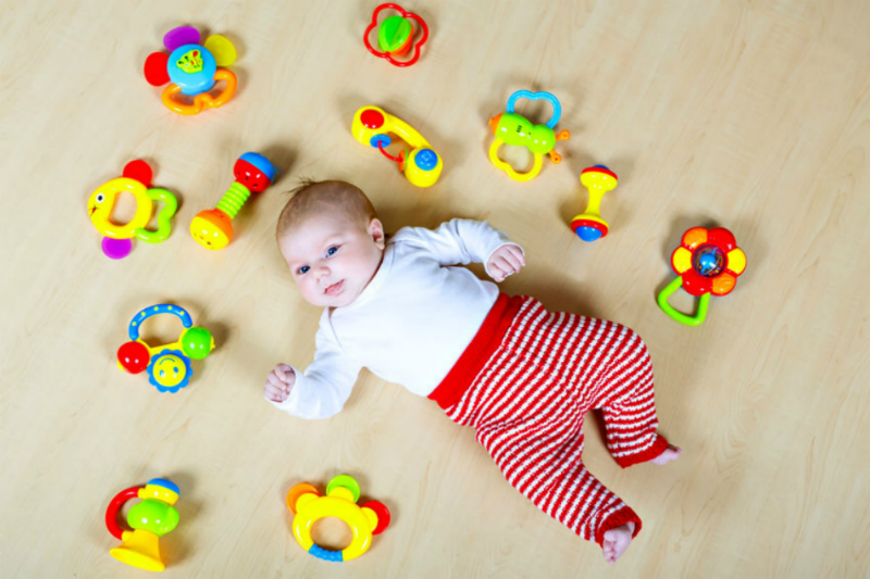 Best musical toys for early years - Baby with rattles