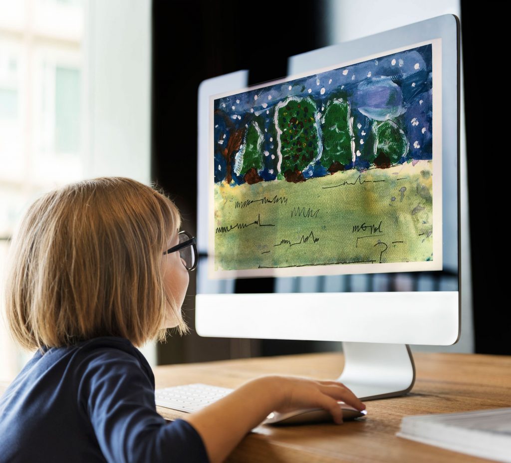 child using computer to make art