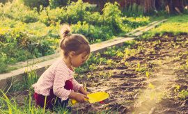 Pre-school aged child doing outdoor activities.